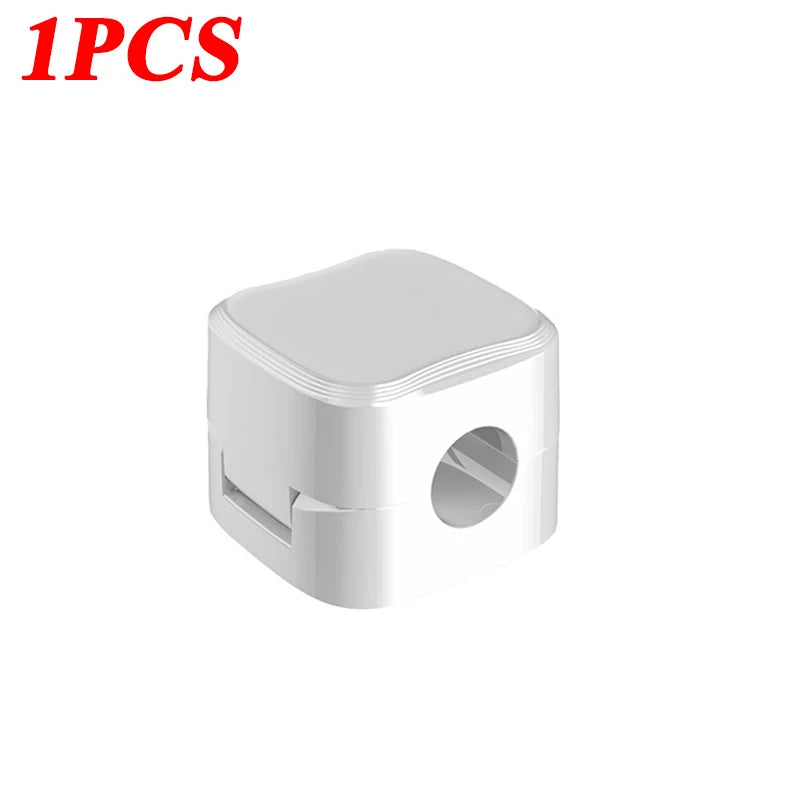 White compact Magnetic Cable Clip Cable Holder Adhesive Wire Keeper Cord Cable Organizer for Home Office Under Desk Management with a hole for cable insertion.