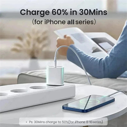 PD 40W Fast Charger For iPhone 14 13 12 11 15 16 Pro Max Phone Charger For iPhone 15 16 Plus USB C Cable Fast Charging Data Line charging an iPhone on a white table near a power strip.