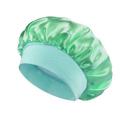 Women Satin Bonnet Hair Bonnet for Sleeping Hair Care Silk Bonnets Solid Wide-brimmed Sleeping Hat with Elastic Soft Band in shiny light green satin for gentle hair protection.