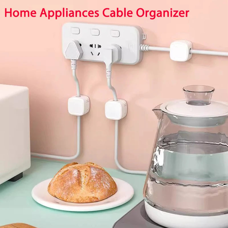 Magnetic Cable Clip Cable Holder Adhesive Wire Keeper Cord Cable Organizer for Home Office Under Desk Management neatly securing multiple appliance cords along a kitchen wall near a kettle and bread.