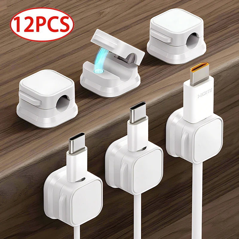 Set of white Magnetic Cable Clip Cable Holder Adhesive Wire Keeper Cord Cable Organizer for Home Office Under Desk Management holding various charging cables neatly on wooden surface.