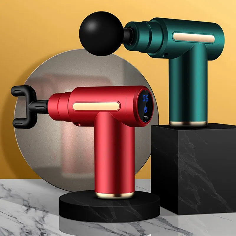 Two Mini Muscle Massage Gun Protable Body Massager Deep Handheld Percussion Massager For Body Back And Neck Leg devices in red and green colors displayed on black platforms against a yellow and gray background.