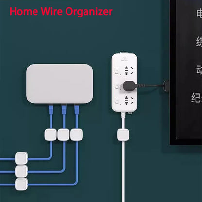 Organized blue and white cables held neatly in place on a dark wall using Magnetic Cable Clip Cable Holder Adhesive Wire Keeper Cord Cable Organizer for Home Office Under Desk Management.
