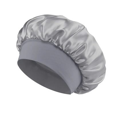 Women Satin Bonnet Hair Bonnet for Sleeping Hair Care Silk Bonnets Solid Wide-brimmed Sleeping Hat with Elastic Soft Band in smooth silver satin fabric designed for comfortable nightly hair protection.