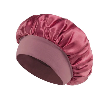 Women Satin Bonnet Hair Bonnet for Sleeping Hair Care Silk Bonnets Solid Wide-brimmed Sleeping Hat with Elastic Soft Band in shiny pink satin fabric designed for comfortable nighttime hair protection.