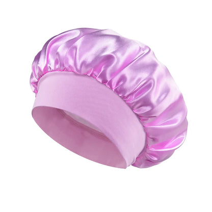 Women Satin Bonnet Hair Bonnet for Sleeping Hair Care Silk Bonnets Solid Wide-brimmed Sleeping Hat with Elastic Soft Band in shiny pink satin material designed for hair protection during sleep