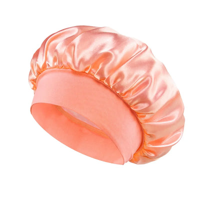 Women Satin Bonnet Hair Bonnet for Sleeping Hair Care Silk Bonnets Solid Wide-brimmed Sleeping Hat with Elastic Soft Band in a shiny peach color for comfortable nighttime hair protection